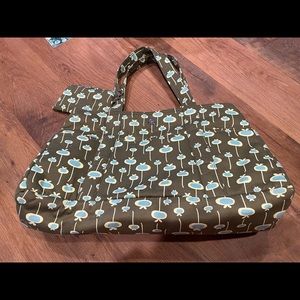 Large tote bag with 8 outside pockets and 7 inside pockets.